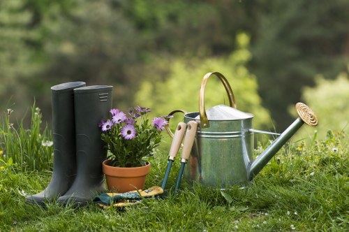 Technician pruning overgrown plants